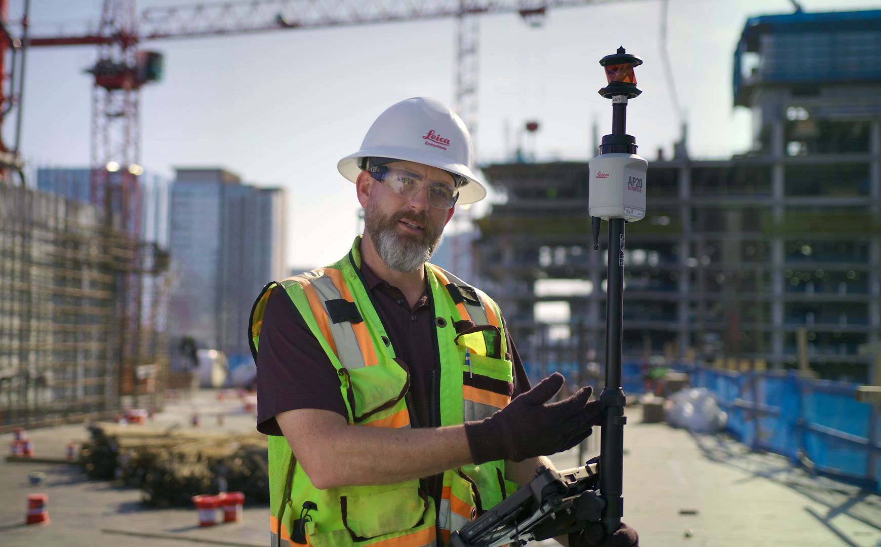 Construction worker drilling holes for a suspended ceilling installation with Leica iCON trades.